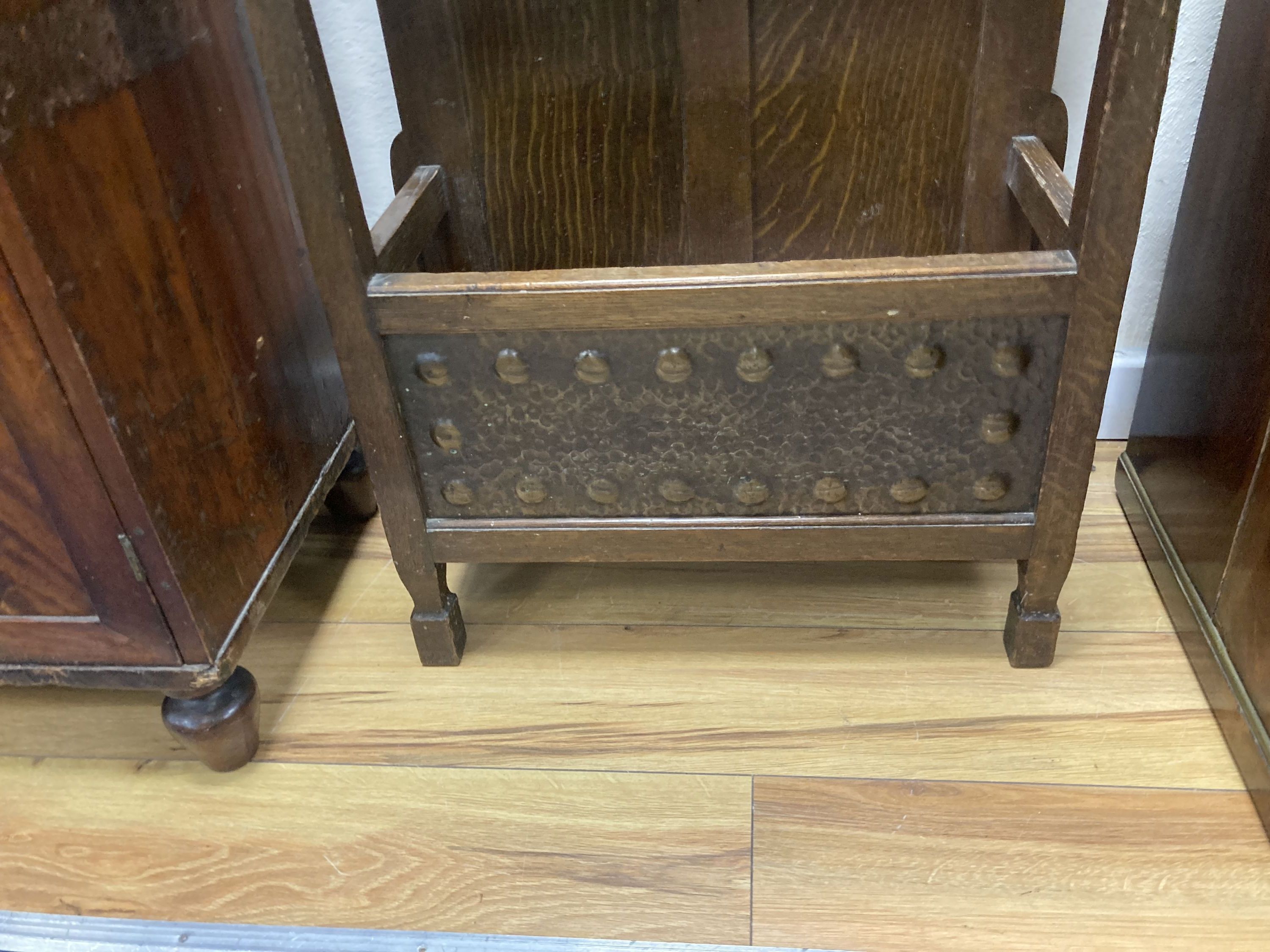 An early 20th century oak umbrella stand in the Arts & Crafts style, attributed to Shapland & Petter, width 52cm, depth 26cm, height 10